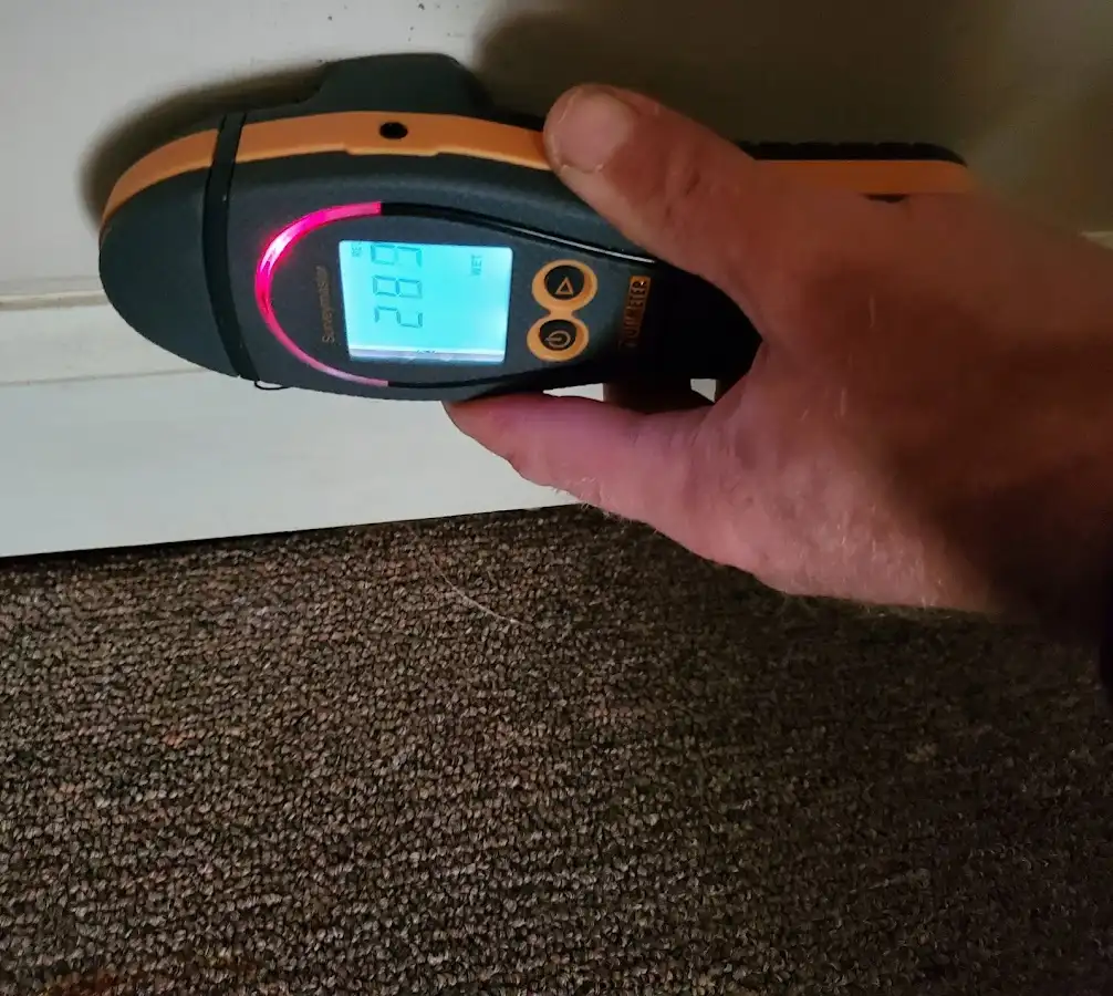 Moisture detection at baseboard during Storm Damage Restoration in Circleville